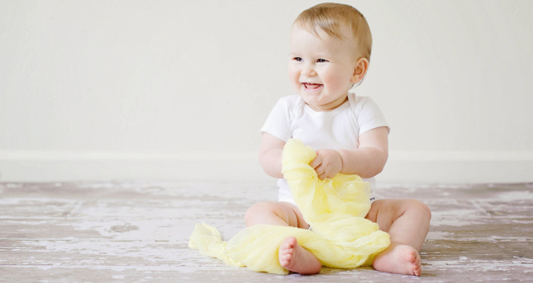 baby smiling showing teeth