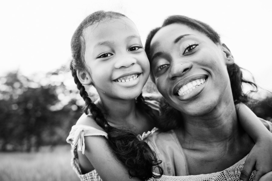 Mom smiles with her daughter before taking her for an orthodontic consultation in Fayetteville, AR