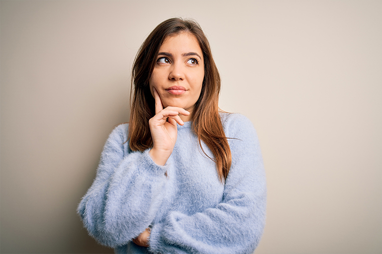 Woman wonders how her overall health affects her gums